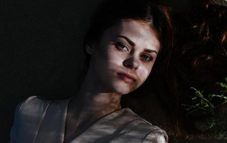 Woman at night Lies on the ground nature fresh airの写真素材