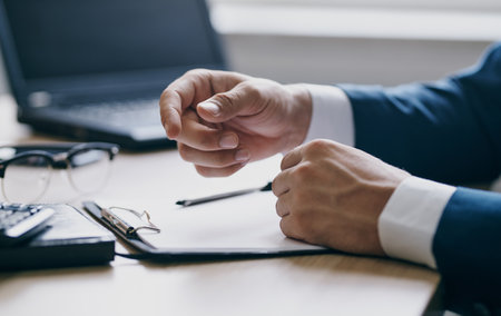 business finance documents on the table laptop glasses pen office stationeryの写真素材