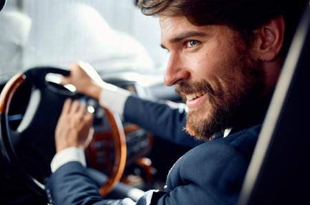 business man in a suit driving a car trip road passenger