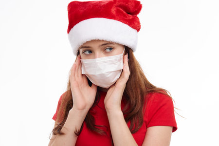 girl wearing a medical mask holiday new year christmas close-upの写真素材