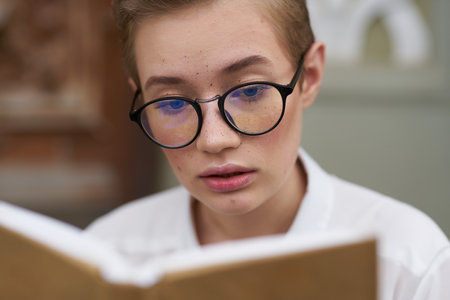 education woman with glasses female student Near the institute book in hands model close-up