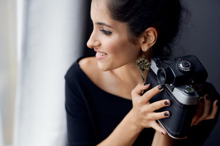happy brunette woman indoors photographer interior smile modelの写真素材