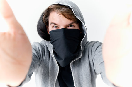 masked man in mask with hood emotions theft isolated backgroundの写真素材