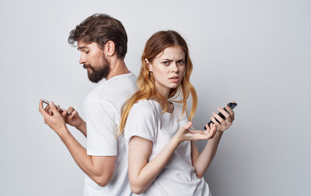 young couple white t-shirt with phone social circle lifestyle friendship