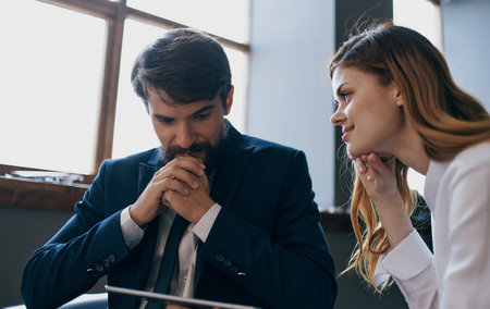 Man and woman in the office tablet work colleagues professionals workの写真素材