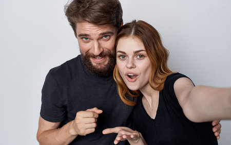 cheerful young family lifestyle in black t-shirtsの写真素材