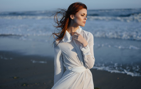 woman on the beach in nature in a white dress walk holiday travelの写真素材