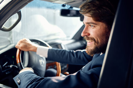 man driving a car trip road official wealthの写真素材