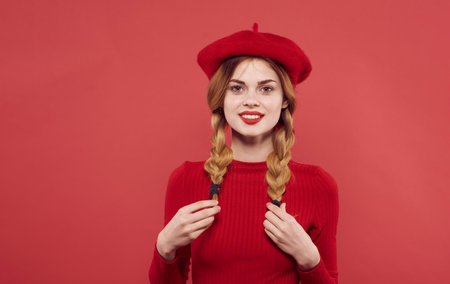 Woman with pigtails red dress hat cropped view isolated backgroundの写真素材
