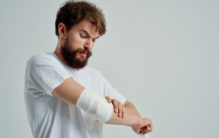man with bandaged arm injury health problem hospital
