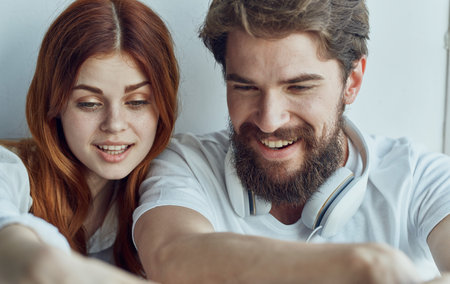 cheerful young couple in headphones listening to music leisure lifestyle joyの写真素材