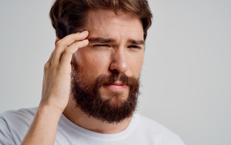 man with headache discontent migraine health problems depressionの写真素材