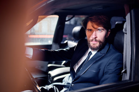 man driving a car wealth elegant style trip luxuryの写真素材