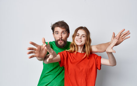young couple multicolored t-shirts lifestyle mockup studioの写真素材