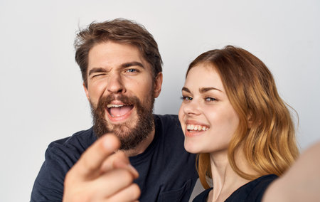 cheerful young family lifestyle in black t-shirtsの写真素材