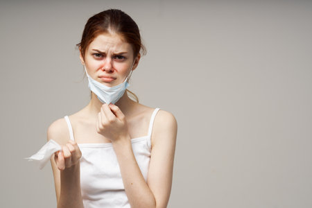 woman medical mask handkerchief cold health problemの写真素材