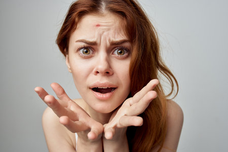 woman with forgiven skin problems emotions discontentの写真素材