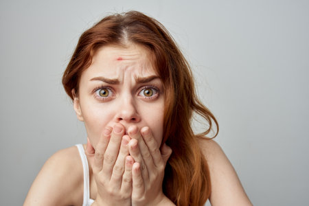 woman with forgiven skin problems emotions discontentの写真素材