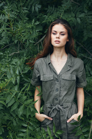 Model posing for camera loneliness outdoor walks jumpsuit suitの写真素材