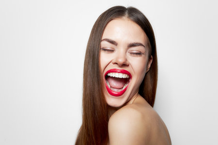 Attractive woman Fun Big smile closed eyes spa treatmentsの写真素材