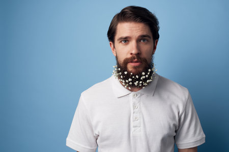 Man in white shirt beard with flowers decorating blue background