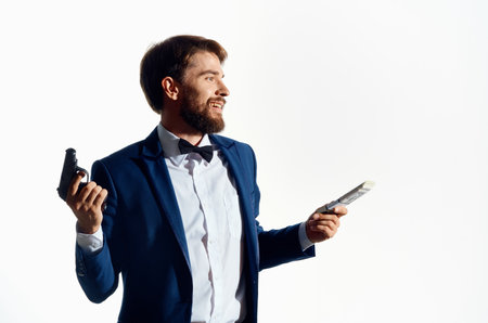a man in a suit master gun holding money mafia