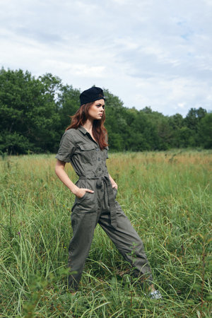 Woman on nature Walk across the field with my hands in the pockets