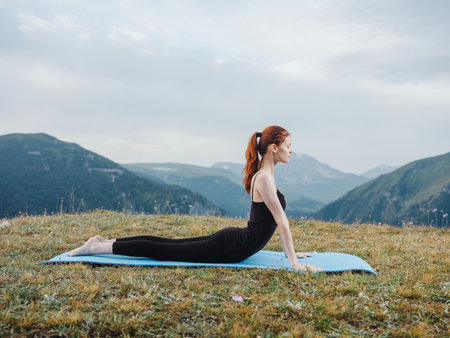 woman goes in for sports outdoors fresh air mountains grassの写真素材