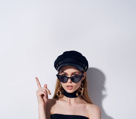 Elegant woman wearing sunglasses jewelry accessories black evening dress modelの写真素材