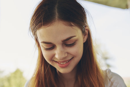 portrait of a cheerful woman outdoors smile model emotionsの写真素材