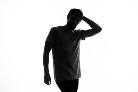 the dark silhouette of a man gesticulate with his hands white background Copy Space