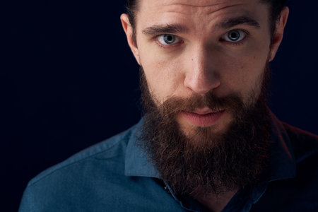 Cheerful man beard emotions black shirt close-upの写真素材
