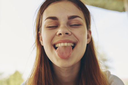 portrait of a cheerful woman outdoors smile model emotionsの写真素材