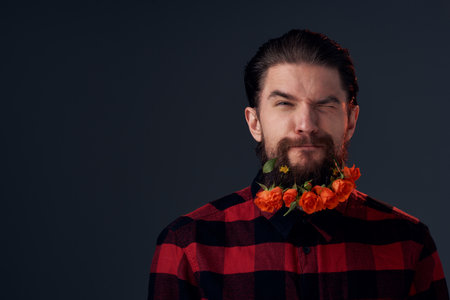 Cute bearded man flowers decoration plaid shirt emotionsの写真素材