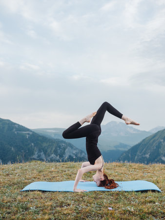 Woman doing yoga exercise mat for fitness nature fresh air mountains