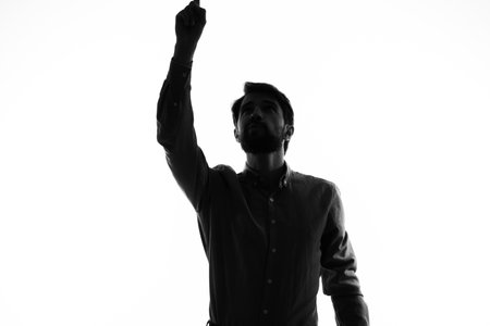 silhouette of a man and gesturing with his hands emotions mysticの写真素材