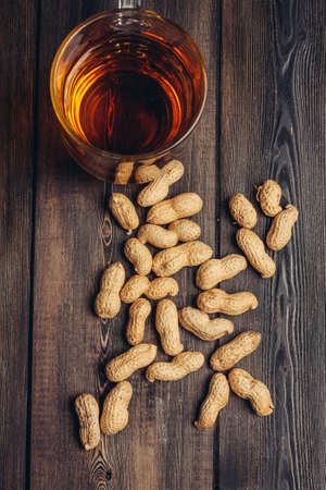 peanuts in shells beer mug bar alcohol snackの写真素材