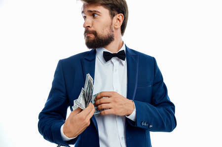rich gentleman in blue jacket bow tie shirt money pack currency