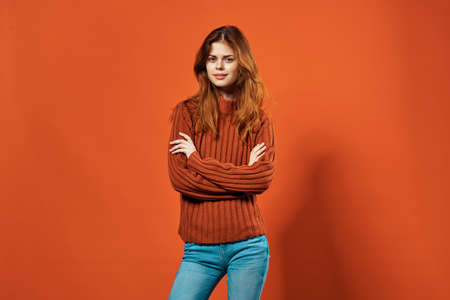 pretty woman red sweater gesture hands posing red background