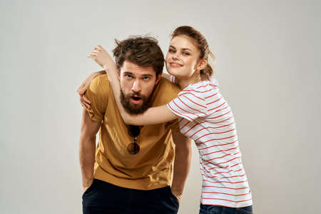 Young couple socializing romance lifestyle fashion fun light background