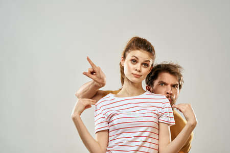 Young couple socializing romance lifestyle fashion fun light backgroundの写真素材