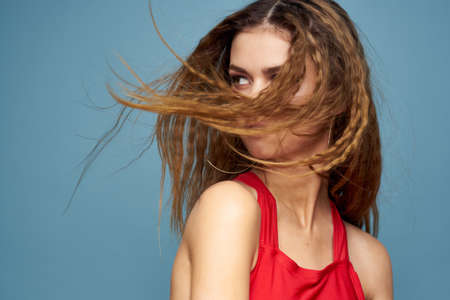 Attractive woman wavy hair charming look cosmetics elegant style blue background