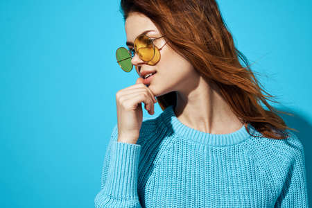 pretty woman in blue sweater fashion hairstyle cropped view lookの写真素材