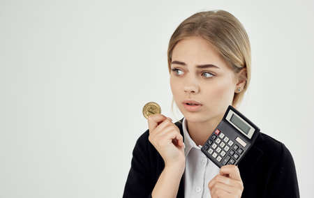 emotional woman with calculator cryptocurrency bitcoin financialの写真素材