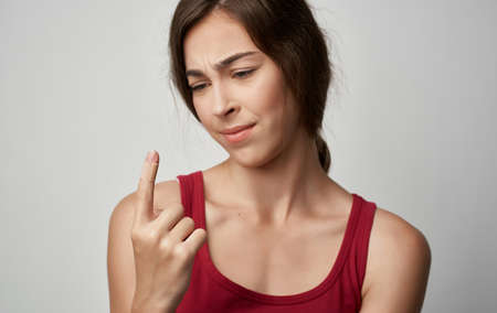 sick woman in red t-shirt health problems cold allergyの写真素材