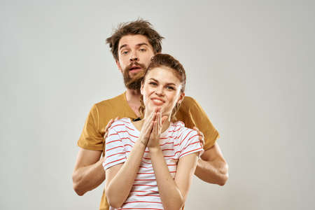 Young couple socializing romance lifestyle fashion fun light backgroundの写真素材