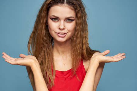 Attractive woman wavy hair charming look cosmetics elegant style blue background