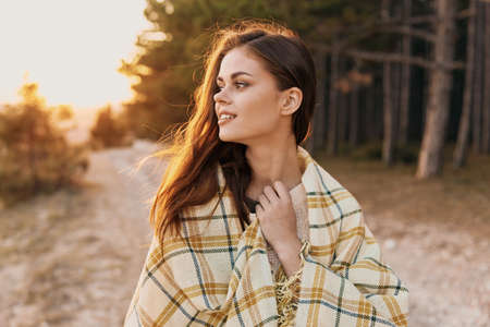 Sunset nature coniferous forest beautiful woman modelの写真素材