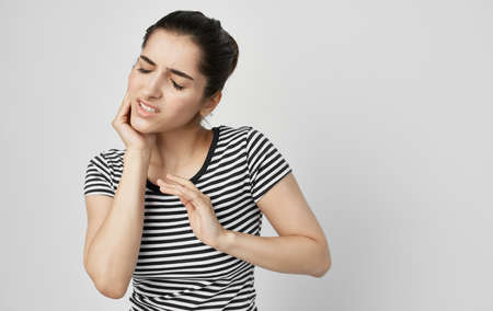 woman holding face dental problems pain dissatisfactionの写真素材