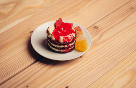 red cake marmalade sweets delight snack wood backgroundの写真素材